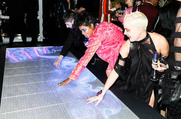 Guests interacting with touch table