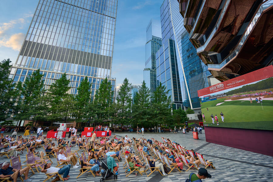 people watch golf at a Big Screen Watch Party