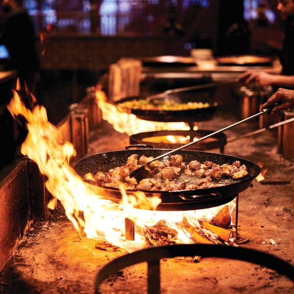 Paella over flame at Mercdo Little Spain