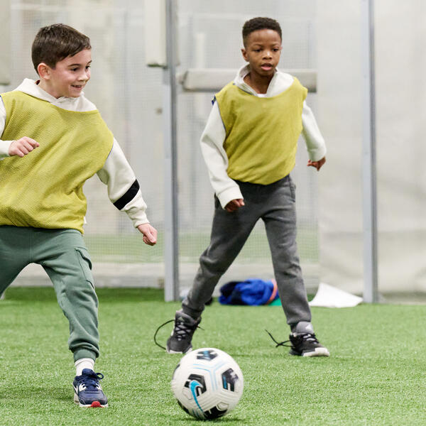 young boy playing soccer