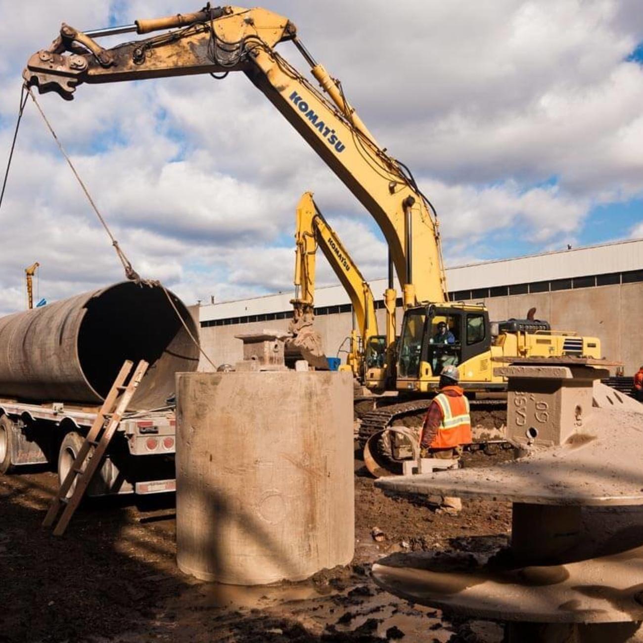 Excavator Lifts Caisson - courtesy of Joe Woolhead