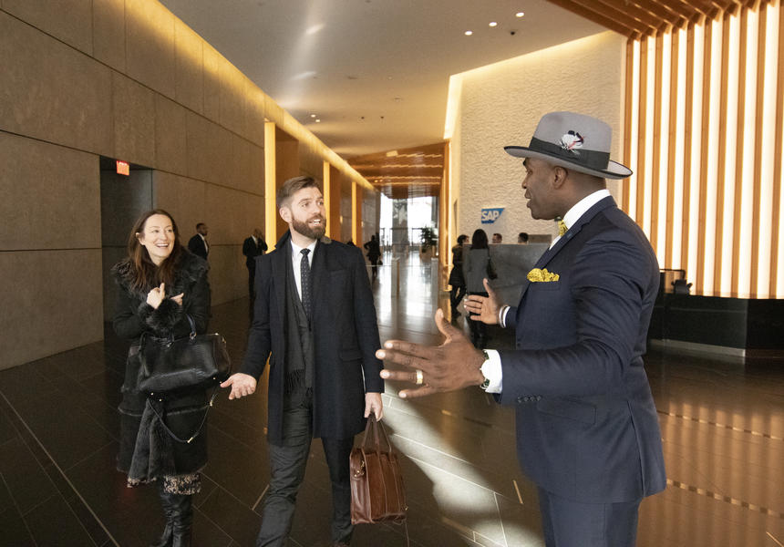 Business People Meeting in Lobby in Suits and Fedora with Yellow Pocket Square