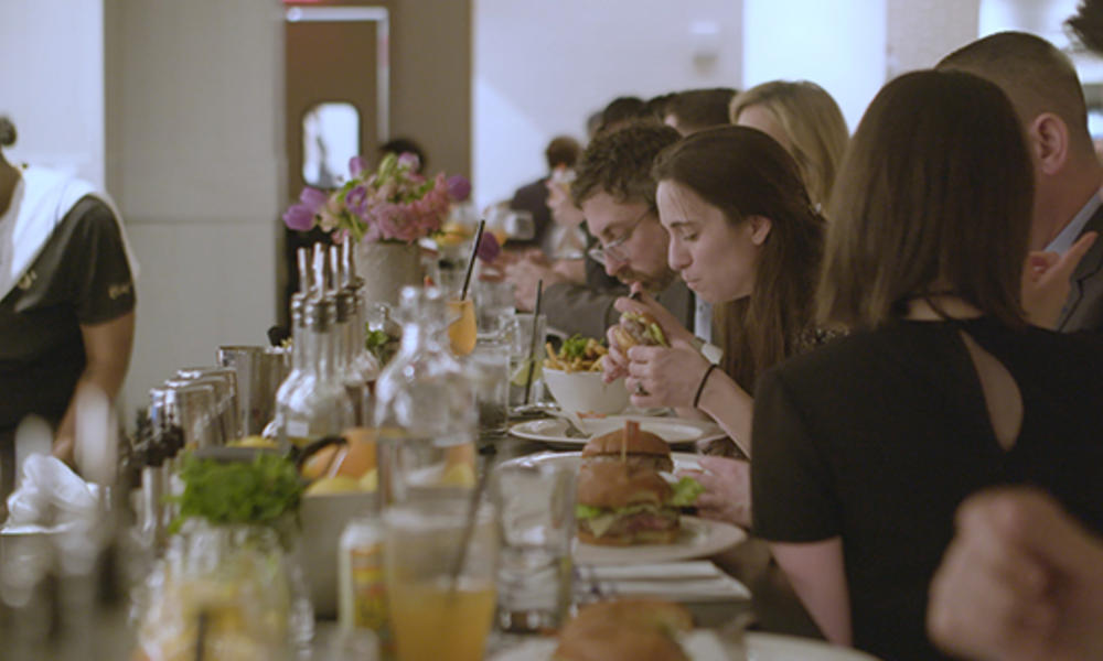 People eating burgers at Belcampo